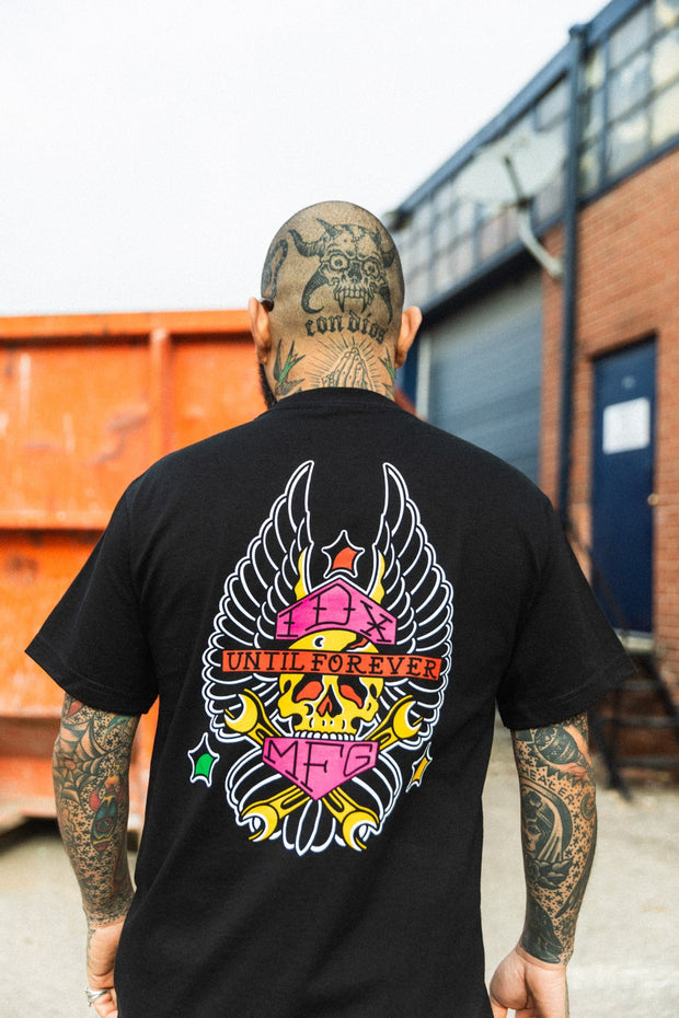 tattoo-style-flash-skull-wings-logo-on-back-of-black-tee-shirt