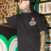 tattoo-man-wearing-tee-with-cobra-front