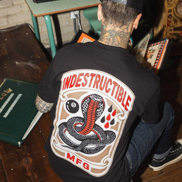 man-wearing-black-tee-with-tattoo-style-cobra-on-back