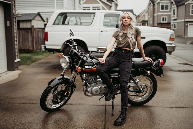 womens-sitting-on-motorcycle-wearing-black-cargo-pants